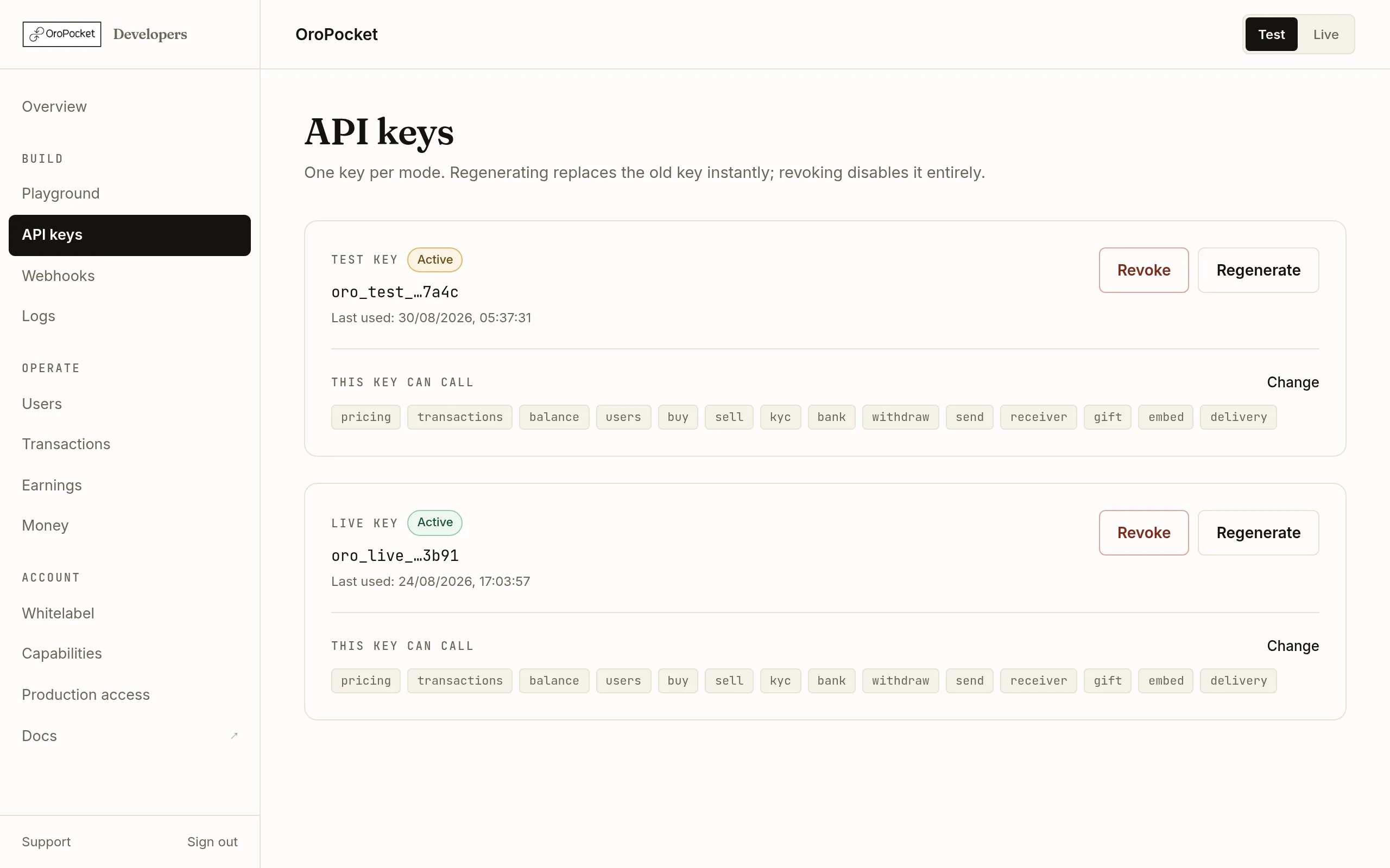 The OroPocket developer dashboard showing the API keys page, with a Test key card and a Live key card side by side and the sidebar navigation on the left.